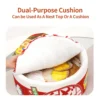 Hand lifting the soft white cushion lid on a red noodle cup pet bed, revealing a snug cat inside, to display the dual-purpose design that can be used as a cozy cover or a separate pet pillow.