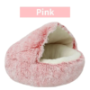 Soft pink faux fur pet bed that offers a snug and inviting space for pets to relax and feel secure.