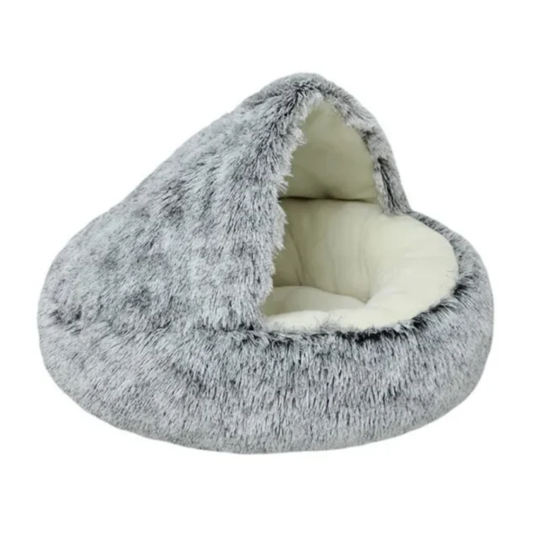 Luxurious faux fur pet bed in a cozy cave design, with plush interior cushioning, inviting pets for a warm, serene snuggle.