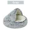 Chic gray faux fur pet bed with a plush interior, offering a stylish and cozy resting place for pets.